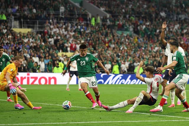 TIMELY: John Stones clears the ball to safety against Mexico during Sunday night's epic 3-2 win in the last 16 against the World Cup co-hosts. Picture: Michael Steele/Getty Images.