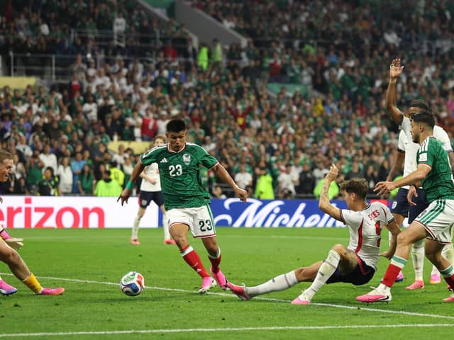 TIMELY: John Stones clears the ball to safety against Mexico during Sunday night's epic 3-2 win in the last 16 against the World Cup co-hosts. Picture: Michael Steele/Getty Images.