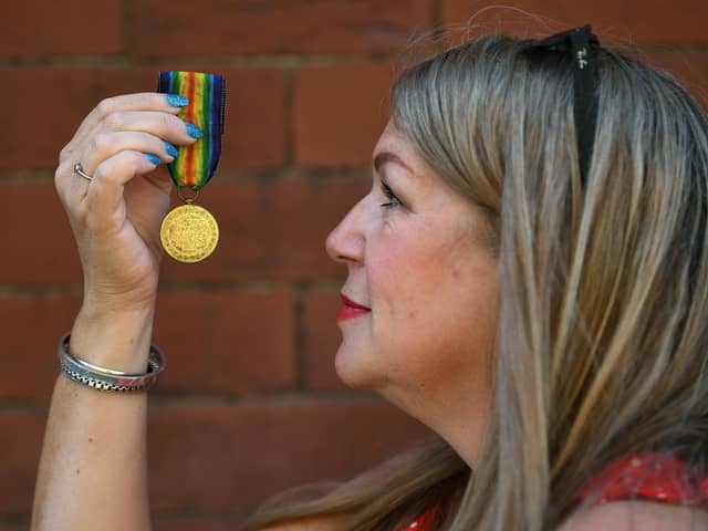 Local historian Anne-Marie Fawcett, with one of the medals.