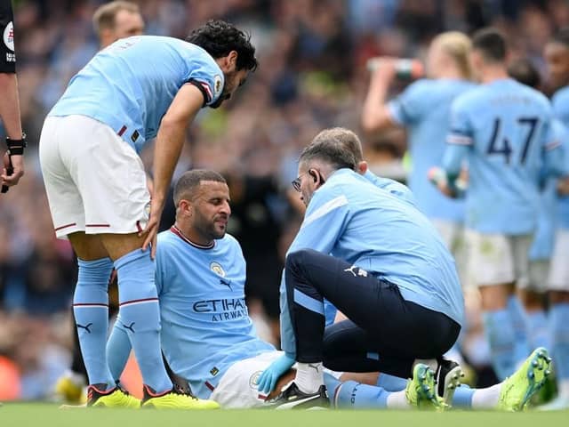 INJURY: Kyle Walker received treatment during Sunday's Manchester derby