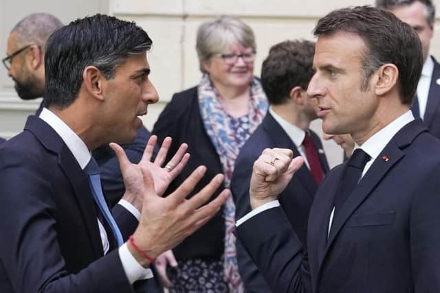 French President Emmanuel Macron, right, and Britain's Prime Minister Rishi Sunak discusses strengthening efforts against Channel migrant crossings. PIC: AP Photo/Michel Euler, Pool
