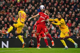 Sheffield United's Jayden Bogle (right) pulls back on Liverpool's Luis Diaz during the Premier League match at Anfield: Picture: Peter Byrne/PA Wire.