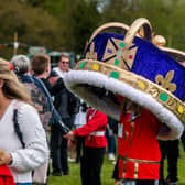 Ilkley Carnival 2023. Pictured One of the Carnival goers carries a giant crown around the main ring of the showfield. Picture By Yorkshire Post Photographer,  James Hardisty. Date: 1st May 2023.