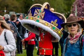 Ilkley Carnival 2023. Pictured One of the Carnival goers carries a giant crown around the main ring of the showfield. Picture By Yorkshire Post Photographer,  James Hardisty. Date: 1st May 2023.