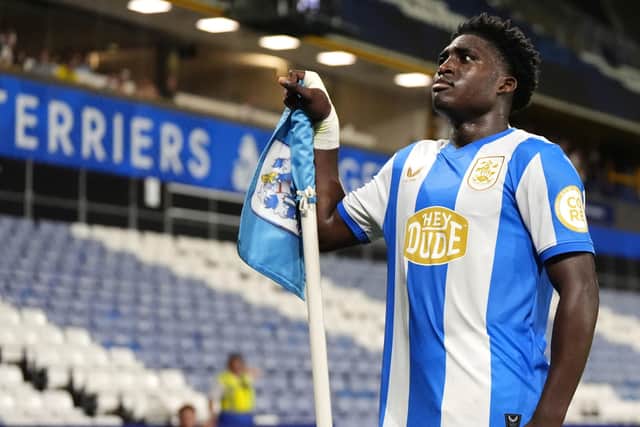 STANDING UP: Cameron Ashia celebrates scoring for the second time in as many Huddersfield Town games (Image: Nick Potts/PA Wire)