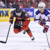 TOP BILLING: Patrick Harper (right) skates against Canada's Kale Clague during the World Junior Hockey Championships in Toronto where he helped his country win a gold medal. Picture: Claus Andersen/Getty Images