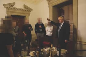 Handout photo issued by the House of Commons showing the then prime minister Boris Johnson (right) at a leaving gathering in the vestibule of the Press Office of 10 Downing Street, London, when rules were in force for the prevention of the spread of Covid, which was released in the Committee of Privileges report. PIC: PA