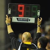STOPPAGE TIME:  Fourth official Howard Webb displays nine minutes of added time during a 2013 Premier League match between Wigan Athletic and Swansea City but long delays are becoming more commonplace now