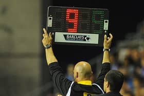 STOPPAGE TIME:  Fourth official Howard Webb displays nine minutes of added time during a 2013 Premier League match between Wigan Athletic and Swansea City but long delays are becoming more commonplace now