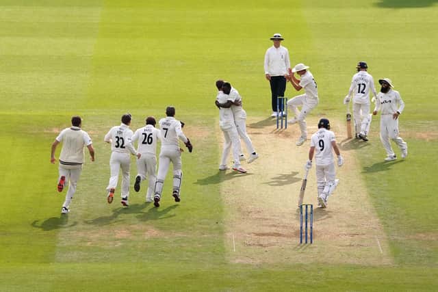 Surrey celebrate the key wicket of Adam Lyth, Yorkshire's top-scorer in the second innings with 46, after he is caught at third slip by Ryan Patel off Kemar Roach. Picture: Adam Davy/PA Wire