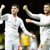 Barnsley's Corey O'Keeffe (left) and John McAtee celebrate at the final whistle after beating hosts Oxford United at the Kassam Stadium in January. Picture: David Davies/PA
