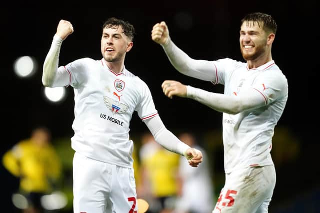 Barnsley's Corey O'Keeffe (left) and John McAtee celebrate at the final whistle after beating hosts Oxford United at the Kassam Stadium in January. Picture: David Davies/PA