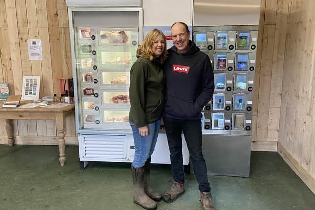 Louise and Mark Day in front of the New Sheepfold Farm meat vending machine.