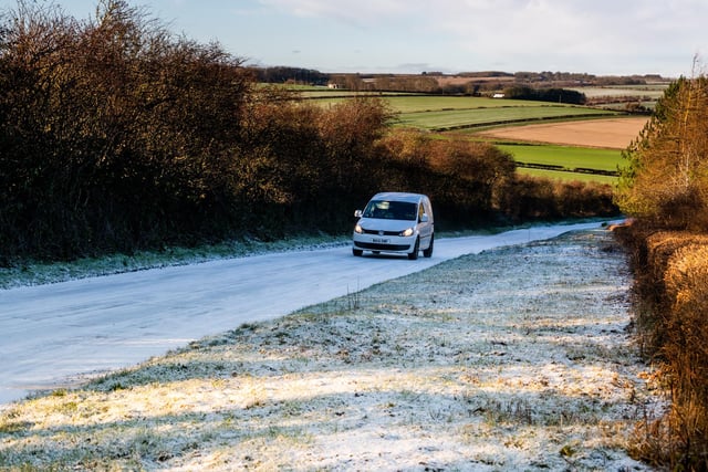 The first covering of snow over the tops of the Wolds, East Yorkshire, as The Met Office issue a Yellow weather warnings due to cold air from the Arctic crossing the UK with concerns of snow and ice on high ground. Pictured A motorists drives along the lightly snow covered Thwing Road between Kilham and Thwing.