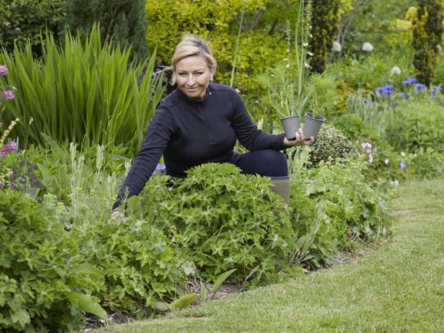 Anya Lautenbach in her garden. Picture: Britt Willoughby-Dyer/Dorling Kindersley/PA.