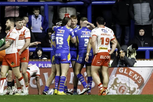 Leeds' Luis Roberts is congratulated on scoring a try against St Helens. (Photo: Allan McKenzie/SWpix.com)