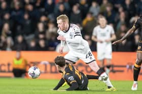 Middlesbrough's Lewis O'Brien goes past Hull City rival Tyler Morton in the recent Championship game. Picture: Tony Johnson.