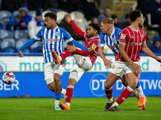 Josh Koroma holds off Jay Dasilva in Huddersfield Town's game with Bristol City last month. Picture: Bruce Rollinson.