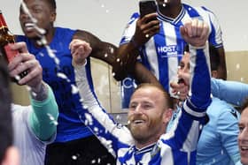 HISTORIC WIN: Barry Bannan leads the dressing-room celebrations after Sheffield Wednesday's incredible win over Peterborough United