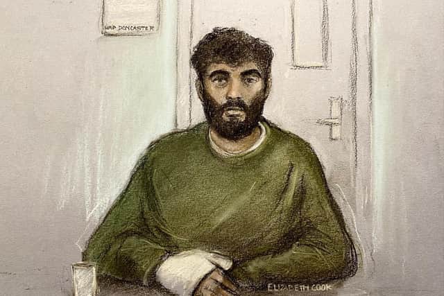 Court artist sketch by Elizabeth Cook of Hassan Jhangur, appearing via video link from HMP Doncaster, during a hearing at Sheffield Crown Court where he is charged with the murder of father-of-two Chris Marriott. Mr Marriott died after being hit by a car while trying to help a stranger in Sheffield. Jhangur is also charged with five counts of attempted murder.  Elizabeth Cook/PA Wire