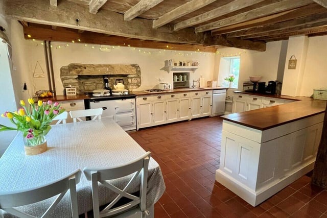 The farmhouse kitchen with Aga is full of charm and character