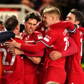 Middlesbrough's Hayden Hackney (centre) celebrates scoring their side's first goal of the game with team-mates fans during the Carabao Cup semi final first leg match at the Riverside Stadium. Picture: Martin Rickett/PA Wire.