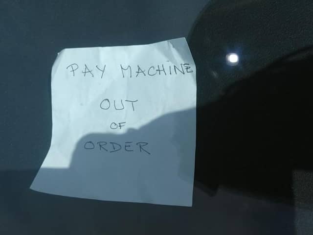A message saying parking ticket machines are out of order left in the window of a car in Hornsea's Eastgate Car Park, in the East Riding of Yorkshire.