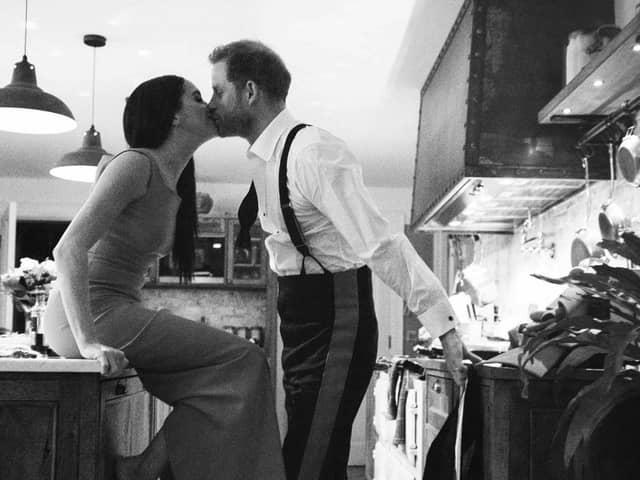 Photo issued by Netflix of the Duke and Duchess of Sussex kissing in a kitchen. The picture is part of a trailer for a new documentary called "Harry and Meghan" - the Sussexes' behind the scenes. The one minute trailer - which featured never before seen private photographs of the couple - was released on the second day of the Prince and Princess of Wales's high profile trip to the US.