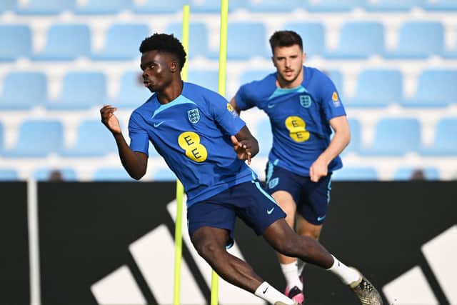 England's forward Bukayo Saka takes part in a training session at the Al Wakrah SC Stadium in Al Wakrah, south of Doha, on December 7, 2022, during the Qatar 2022 World Cup football tournament. - England and France will meet in one of the Qatar 2022 World Cup quarter-finals on December 10. (Photo by PAUL ELLIS/AFP via Getty Images)