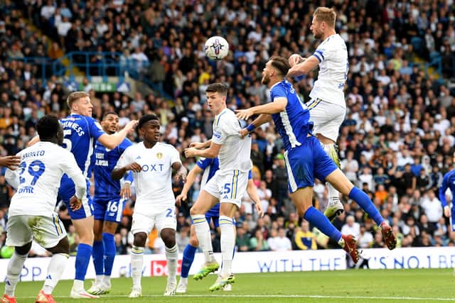 HEAD BOY: Captain Liam Cooper scores Leeds United's opening goal