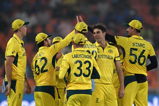 Australia celebrate a convincing win over the old enemy. Photo by Punit Paranjpe/AFP via Getty Images.