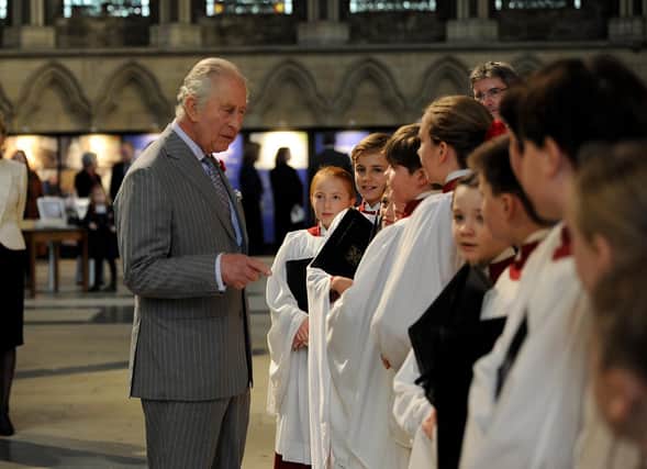 King Charles pictured on his visit to York Minster. The King meets the choir.