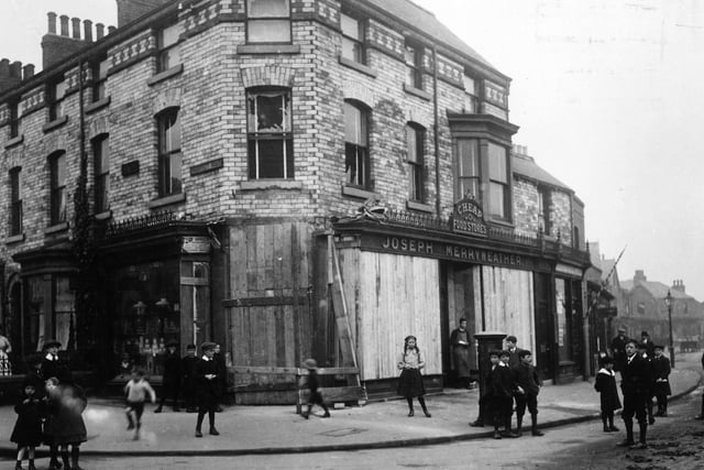 Merryweather's, a shop in Scarborough boarded up as a result of a bombardment of the town by German battlecruisers on 16th December. Seventeen people were killed and eight hundred injured when some 500 shells were fired on the town in the space of 30 minutes.