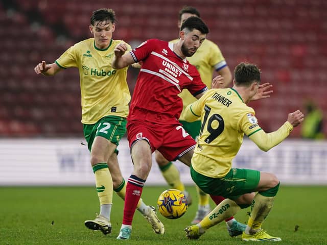 Middlesbrough's Finn Azaz (centre) is challenged for the ball by Bristol City's Taylor Gardner-Hickman (left) and George Tanner (right)  (Picture: PA)