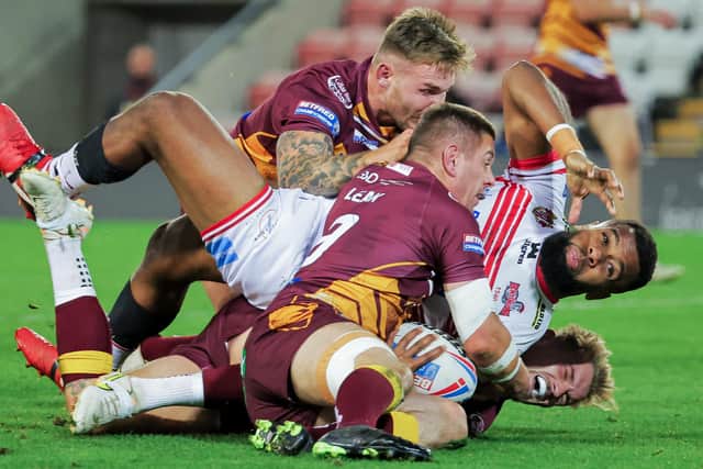 Leigh’s Ben Nakubuwai is tackled by Batley’s Alistar Leak, Ben White and Luke Hooley. (Picture: Alex Whitehead/SWpix.com)