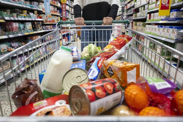 A woman with a shopping trolley full of groceries in a supermarket aisle. PIC: Matthew Horwood/Getty Images