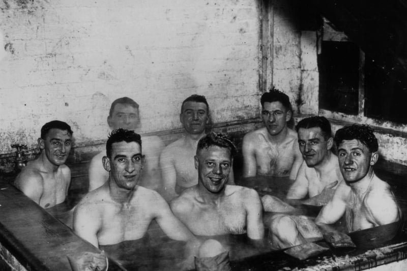 26th November 1937:  Scarborough footballers enjoying a seaweed bath during preparations for an FA Cup match.