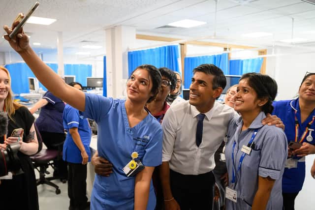 Prime Minister Rishi Sunak with members of staff in the same day emergency care unit during a visit to Milton Keynes University Hospital, Milton Keynes. PIC: Leon Neal/PA Wire