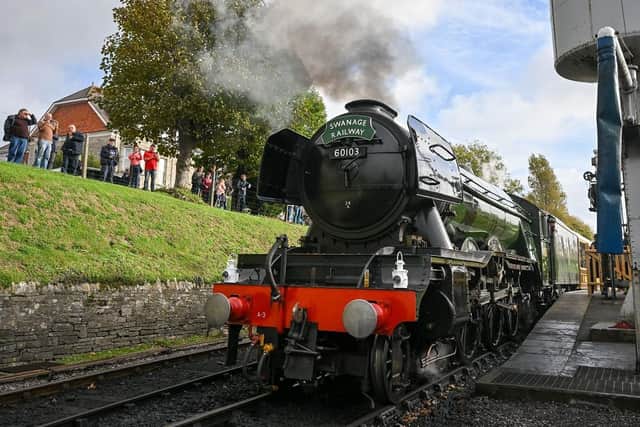 The steam engine Flying Scotsman sets off from Swanage platform. (Pic credit: Finnbarr Webster / Getty Images)