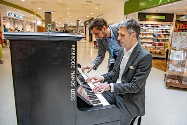 Leeds-based piano firm Besbrode Pianos have donated a piano to Bradford Royal Infirmary for the benefit of patients and staff.
Director of Estates and Facilities, Mark Holloway and Deputy Chief Executive of Bradford Teaching Hospitals John Holden  play the new piano on the concourse, photographed by Tony Johnson for the Yorkshire Post. 29 March 2023.