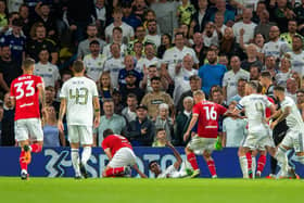 FLASHPOINT: Leeds United's Cody Drameh and Barnsley's Liam Kitching clash in the incident which saw both clubs fined by the Football Association