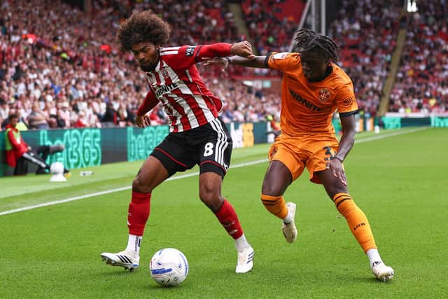 Hamza Choudhury of Sheffield United battles with Mateus Mane of Wolverhampton Wanderers at Bramall Lane. Picture: Jake Youle / Sportimage