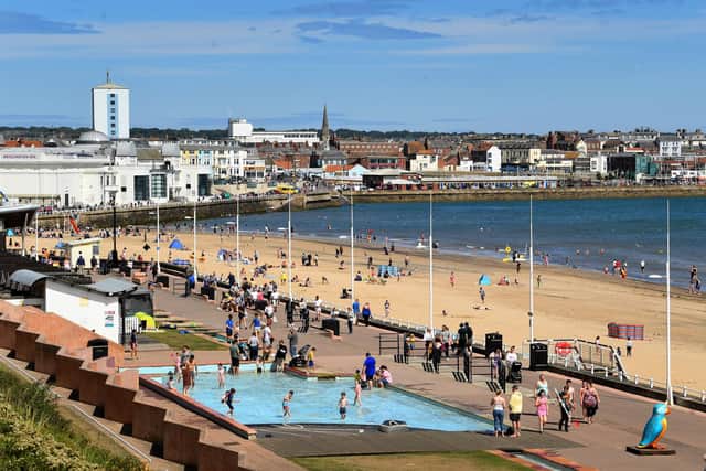 People enjoy the Warm Weather at South Beach, Bridlington