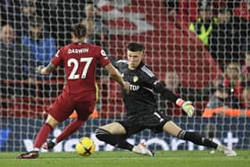 Liverpool's Uruguayan striker Darwin Nunez (L) has his shot saved by Leeds United's French goalkeeper Illan Meslier (R) during the English Premier League football match between Liverpool and Leeds United at Anfield in Liverpool, north west England on October 29, 2022. (Photo by OLI SCARFF/AFP via Getty Images)