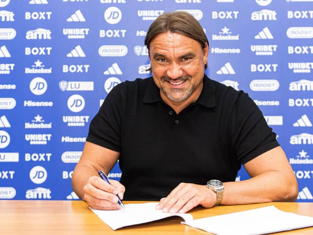 SIGNED UP: New Leeds United manager Daniel Farke puts pen to paper on his new four-year contract