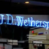 JD Wetherspoon has revealed slowing sales and said it is facing “substantially higher” costs across the group.