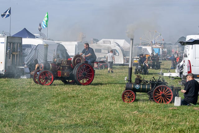 Tents and steam engines set up at the event.