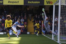 Game over: Huddersfield Town’s Kian Harratt, left centre, scores their decisive third goal in the huge win over Watford (Picture: Steven Paston/PA Wire)