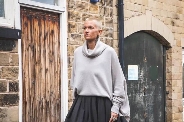 Cashmere Square Cowl Neck Sweater, £750; full pleated skirt, £695; leather mock croc shoes on sale at £197.50; earrings, made in Sheffield by Jennie Gill. All at Nomad Atelier, worn by Mini Underwood.