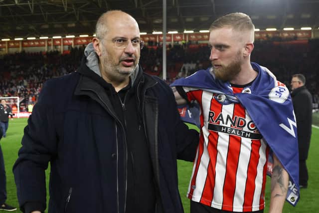 COMMITTED: Owner Prince Abdullah, pictured left with Oli McBurnie, remains engaged with Sheffield United despite his attempts to sell it, according to Chris Wilder